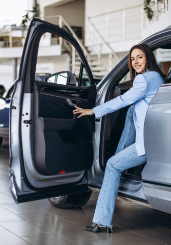 Woman sitting in her new car